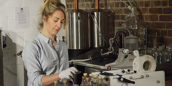 Picture of Jess as she works on bottling Whitby Gin