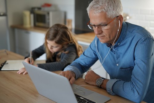 Father and daughter supporting their mental health while working from home