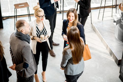 Stock image of women sharing business networking tips