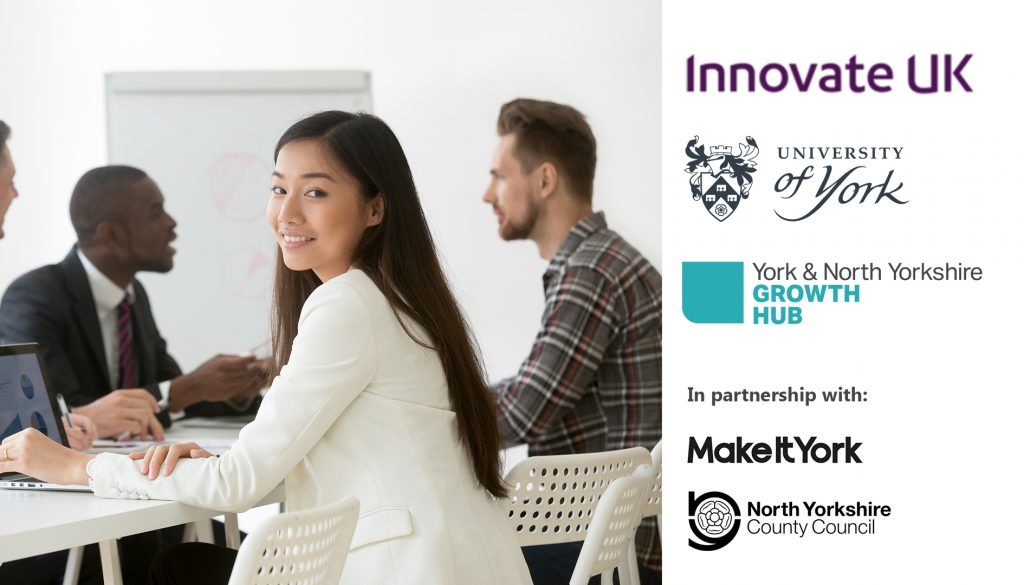 Promotional image for the 'How to get academic insight and experience into your business' webinar. A stock image shows a number of people sat round a table in what appears to be a business environment, with one young woman turning to look at the camera.