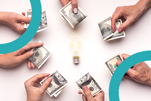 Image of a number of hands holding money, in a circle around a lightbulb, representing investor finance